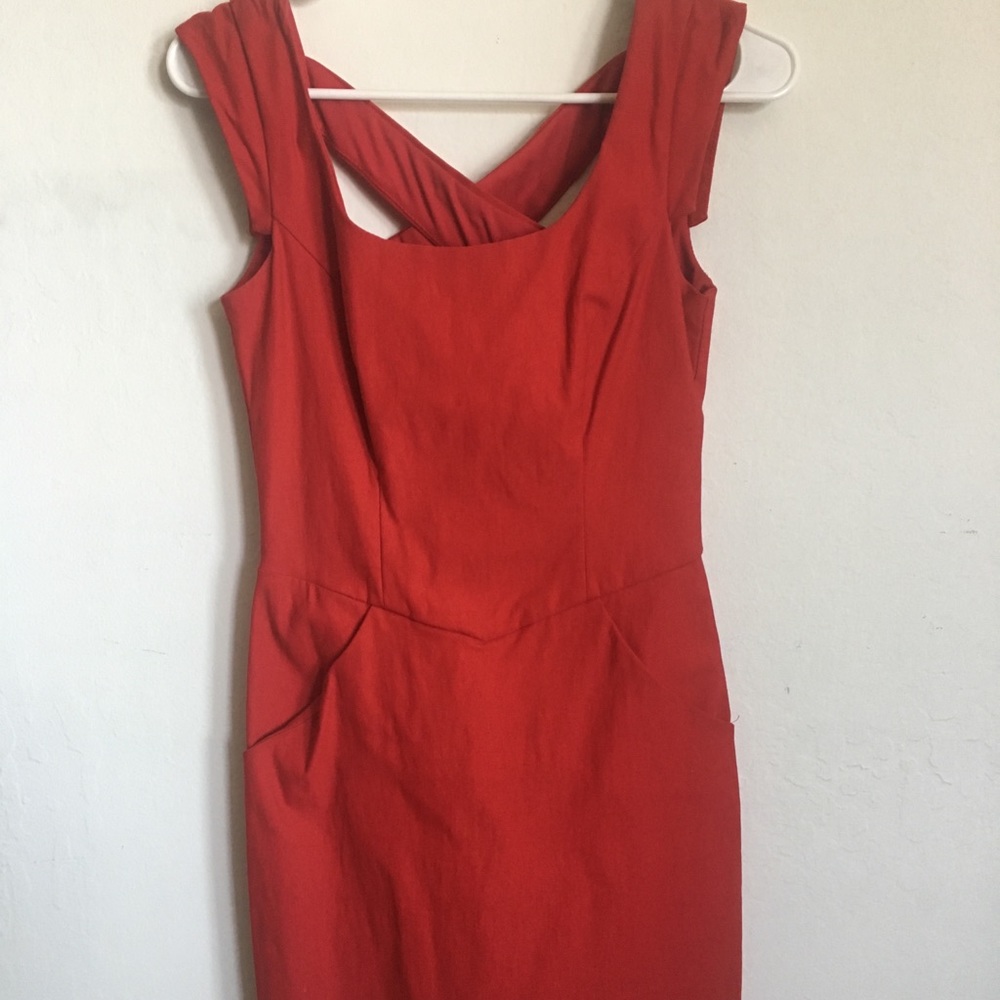 Mini red dress. With a cute strappy back.